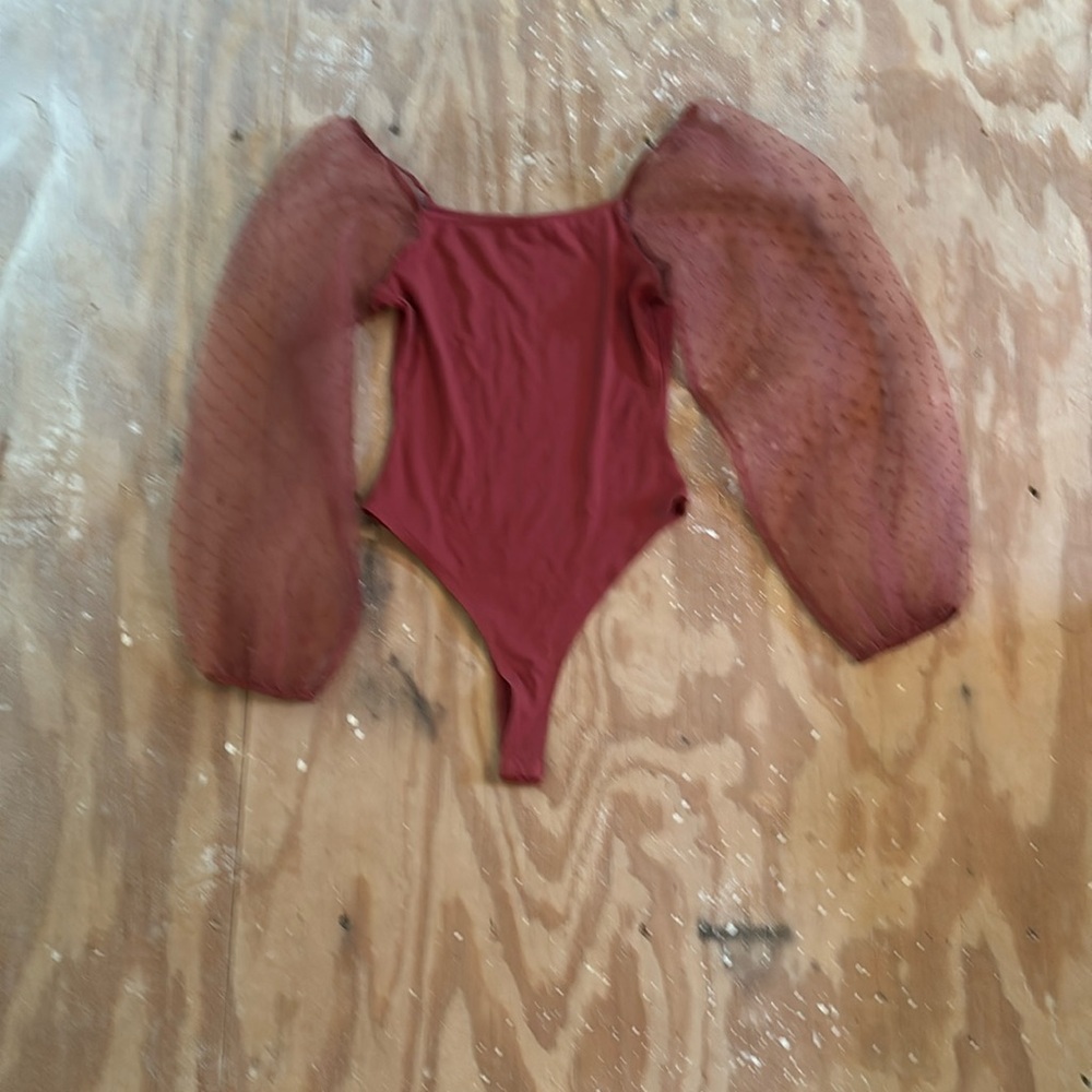 Red burgundy bodysuit with puffy sleeves.